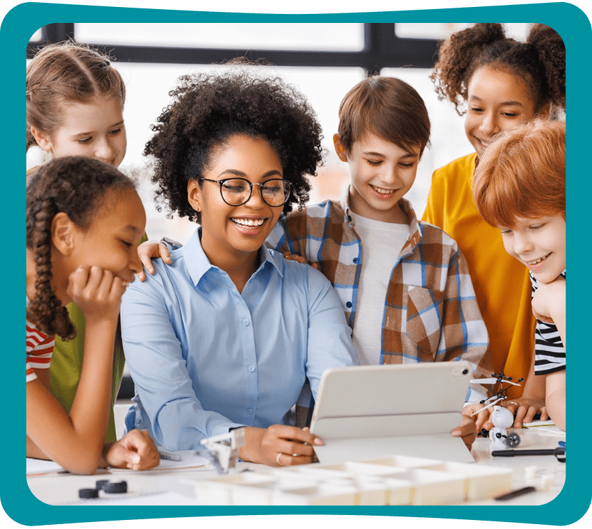Teacher and students smiling at tablet.