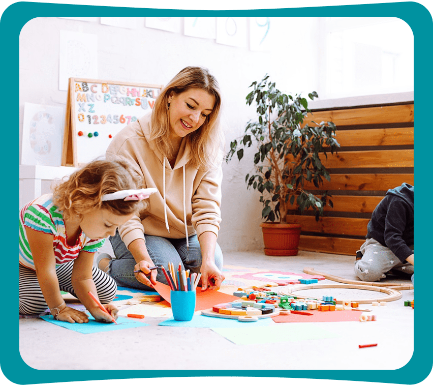 Child and woman playing with educational toys.